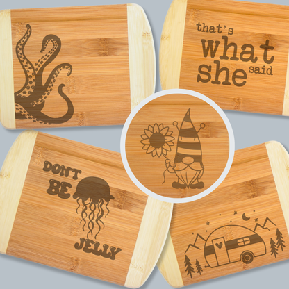 Set of bamboo cutting boards with various engravings on a gray background