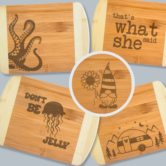 Set of bamboo cutting boards with various engravings on a gray background