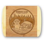 A premium engraved bamboo cutting board featuring "The Island Troll" emblem showcasing a friendly troll with a lantern, a hobbit house with a waterwheel, and Bainbridge Island coordinates, handcrafted by The Blended Oasis.