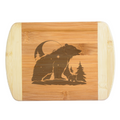 A premium engraved bamboo cutting board featuring a detailed illustration of a mama bear and cub silhouette under a crescent moon with star constellations, handcrafted by The Blended Oasis in Washington State.