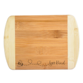 Bamboo cutting board with 'bee kind' engraving on a white background