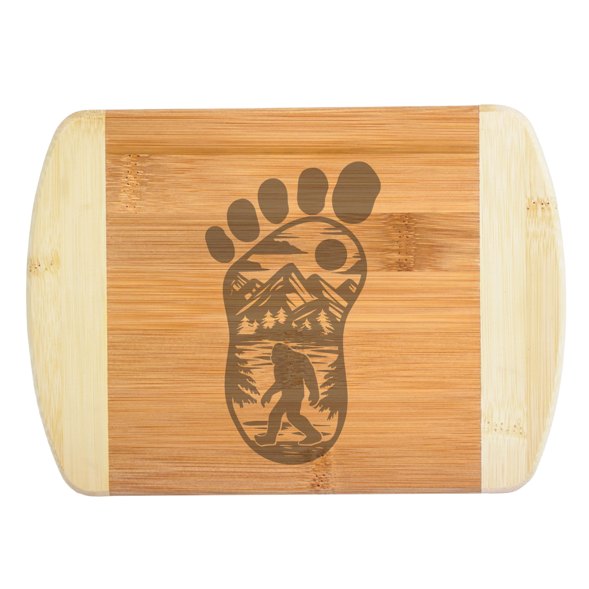 A premium engraved bamboo cutting board featuring an intricate illustration of a giant footprint filled with mountains, trees, and a walking Bigfoot silhouette, handcrafted by The Blended Oasis in Washington State.