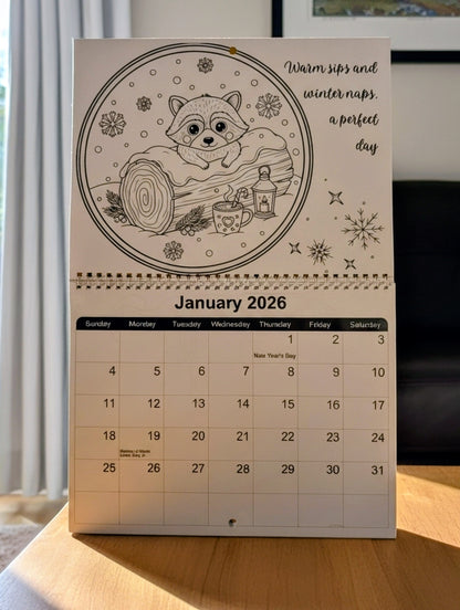 Calendar for January 2026 with a winter-themed design featuring a fox and a cup on a wooden surface.