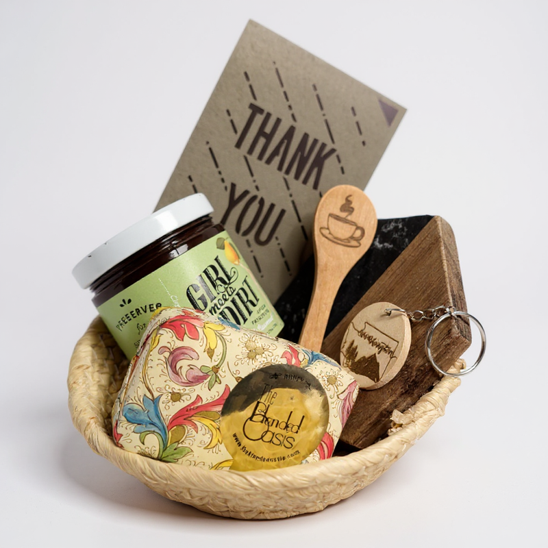 Gift basket with jar, soap, wooden spoon, and keychain on a white background. For real estate agent closings, corporate, business. 