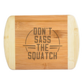 A premium engraved bamboo cutting board featuring a funny retro circular emblem layout that reads Don't Sass the Squatch, handcrafted by The Blended Oasis in Washington State