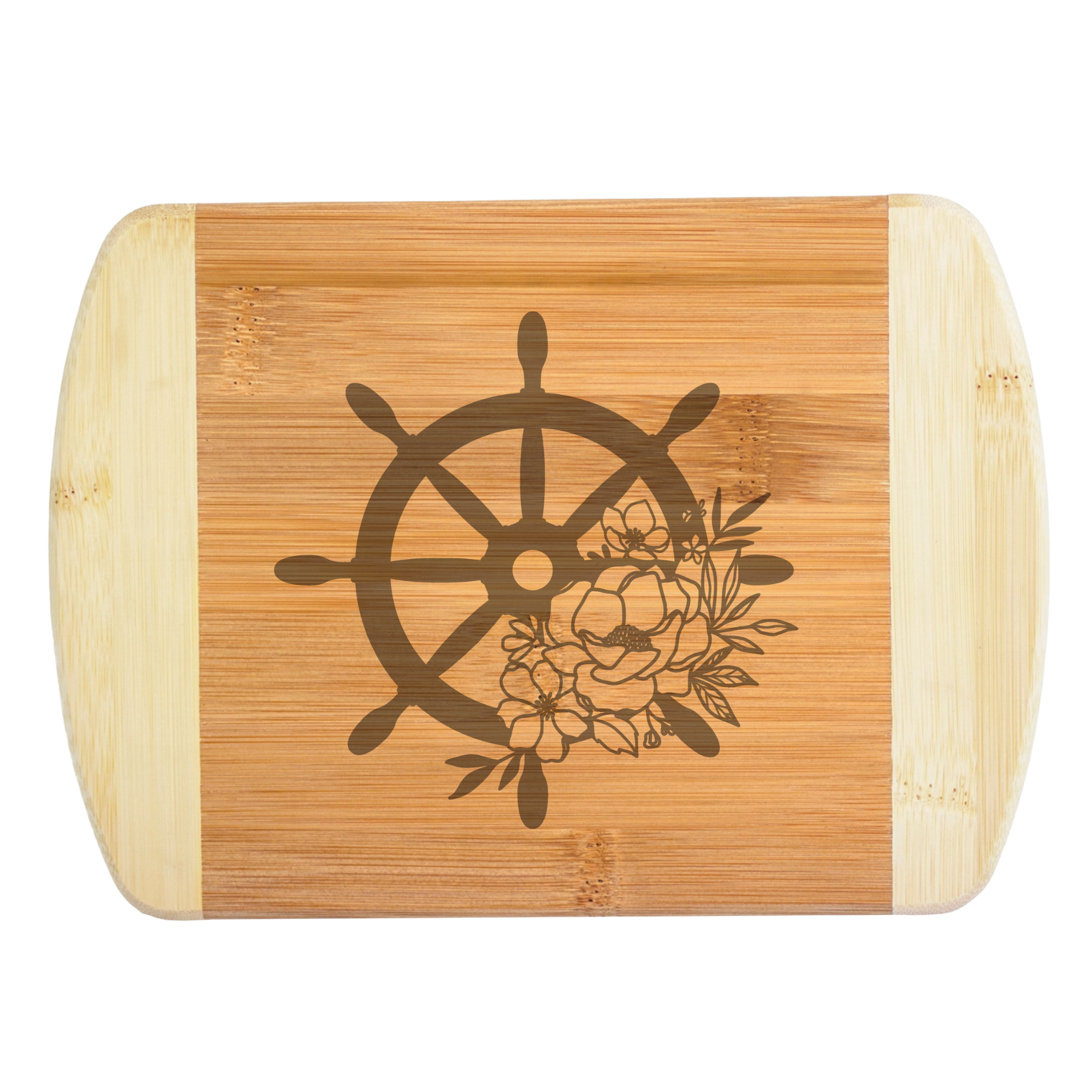 An elegant laser-engraved bamboo cutting board featuring a detailed nautical ship wheel accented with a beautiful bouquet of blooming flowers, handcrafted by The Blended Oasis in Washington State.