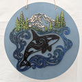 Handcrafted 3D multilayer wood wall art featuring a circular orca and mountain design by The Blended Oasis in Suquamish, Washington.