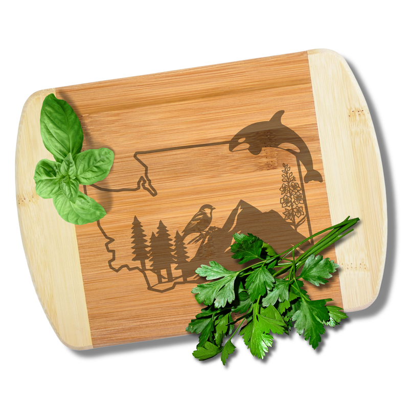 A custom laser-engraved bamboo cutting board featuring a detailed Washington state design, styled with fresh green herbs to demonstrate its 100% food-safe surface.