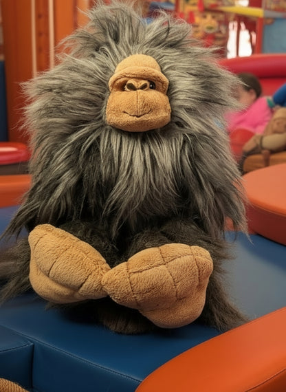 Plush toy gorilla on a colorful playground surface