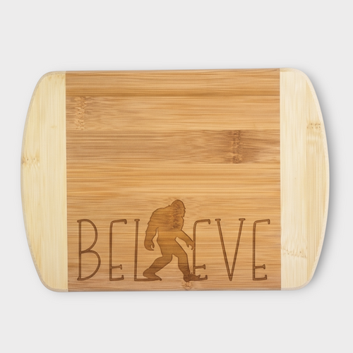 Believe Sasquatch Bamboo laser engraved board on light gray background.