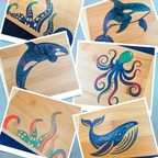 Product showcase collage by The Blended Oasis in Suquamish, WA, featuring their handcrafted artisan bamboo serving boards with vibrant, custom epoxy resin marine life inlays, including an orca, a detailed octopus, a blue whale, and kraken tentacles.